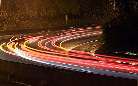 car head lights going round a corner