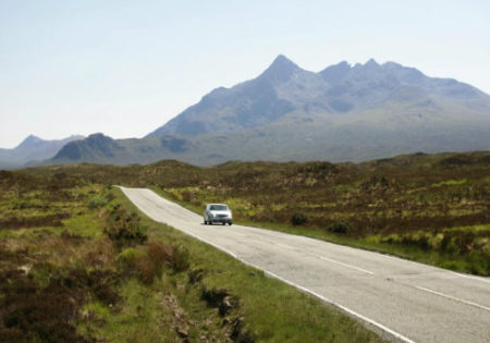 car driving in the scottish highlands