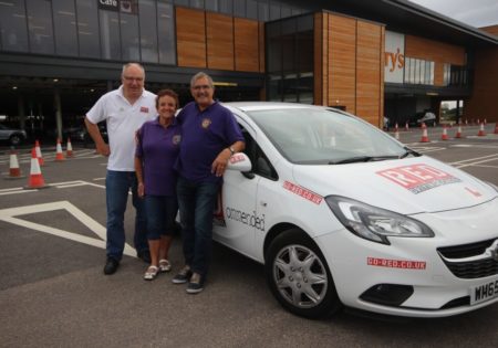 Thanet Lions infront of white RED car