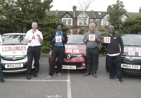 men holding ABO plates