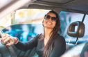 Woman smiling in driver seat