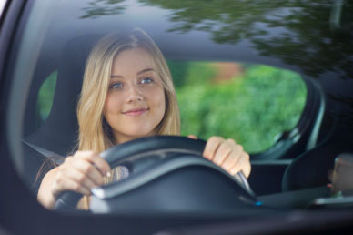 Woman smiling while driving