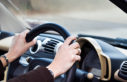 Hand on steering wheel