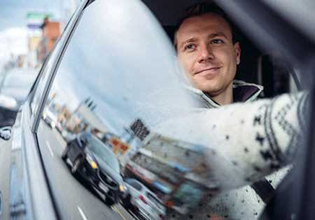 Man in car with window down