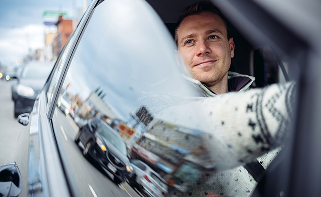 Man in car with window down