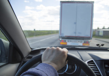 Driving a car on the freeway. Overtaking car.