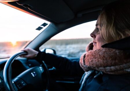 woman in scarf driving