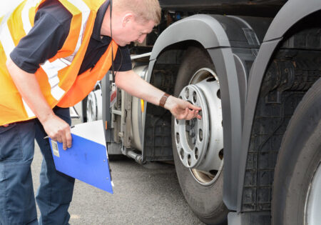 man checking lorry types