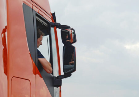 driver looking in wing mirror