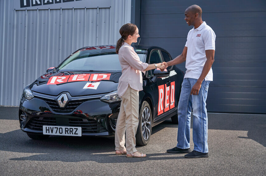 RR driving instructor shaking hands