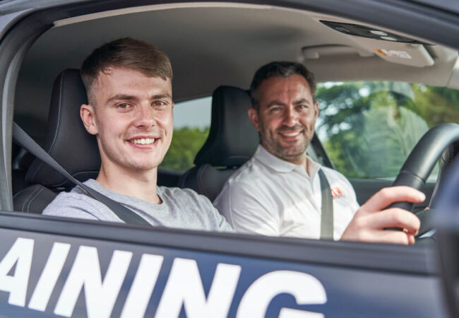 Instructor and learner smiling