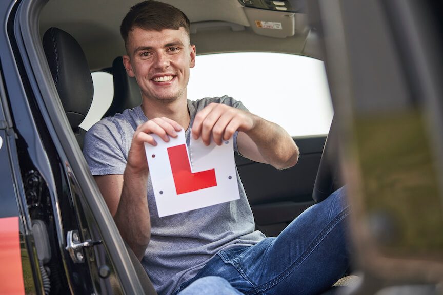 Male ripping up L plates