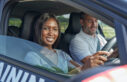 Female smiling inside car