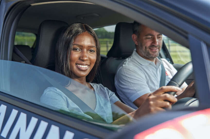 Female smiling inside car