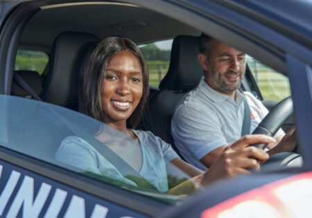 Woman smiling while driving